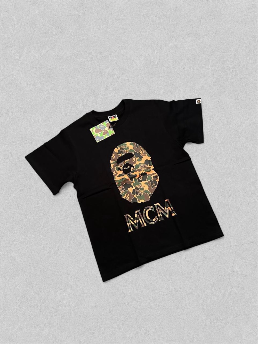 Bape Black Tee with Tan/Green Camo Ape Head and MCM Logo